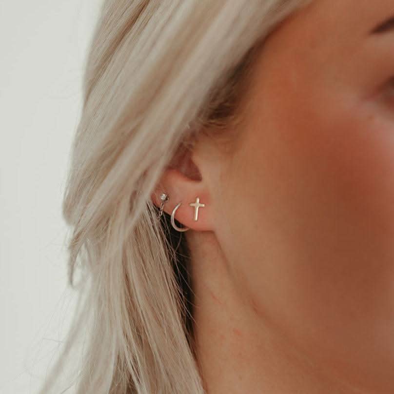 Hypoallergenic Cross Stud Earrings by Barberry & Lace Jewelry, featuring a minimalist sterling silver cross design ideal for sensitive ears.