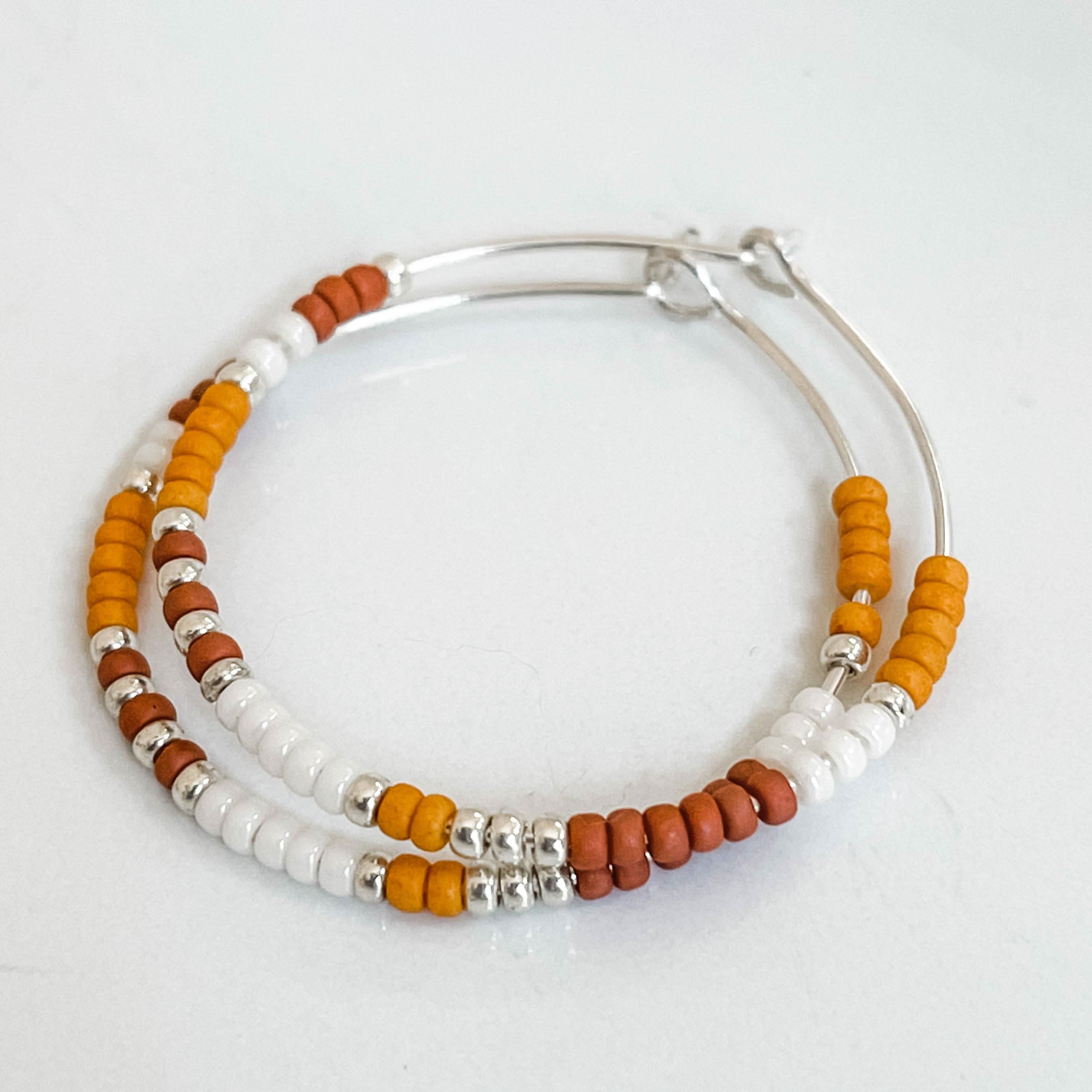 Pumpkin Spice Fall Edition - Beaded Hoop Earrings with rust, orange, and white beads on sterling silver hoops. Cozy fall jewelry by Barberry & Lace.