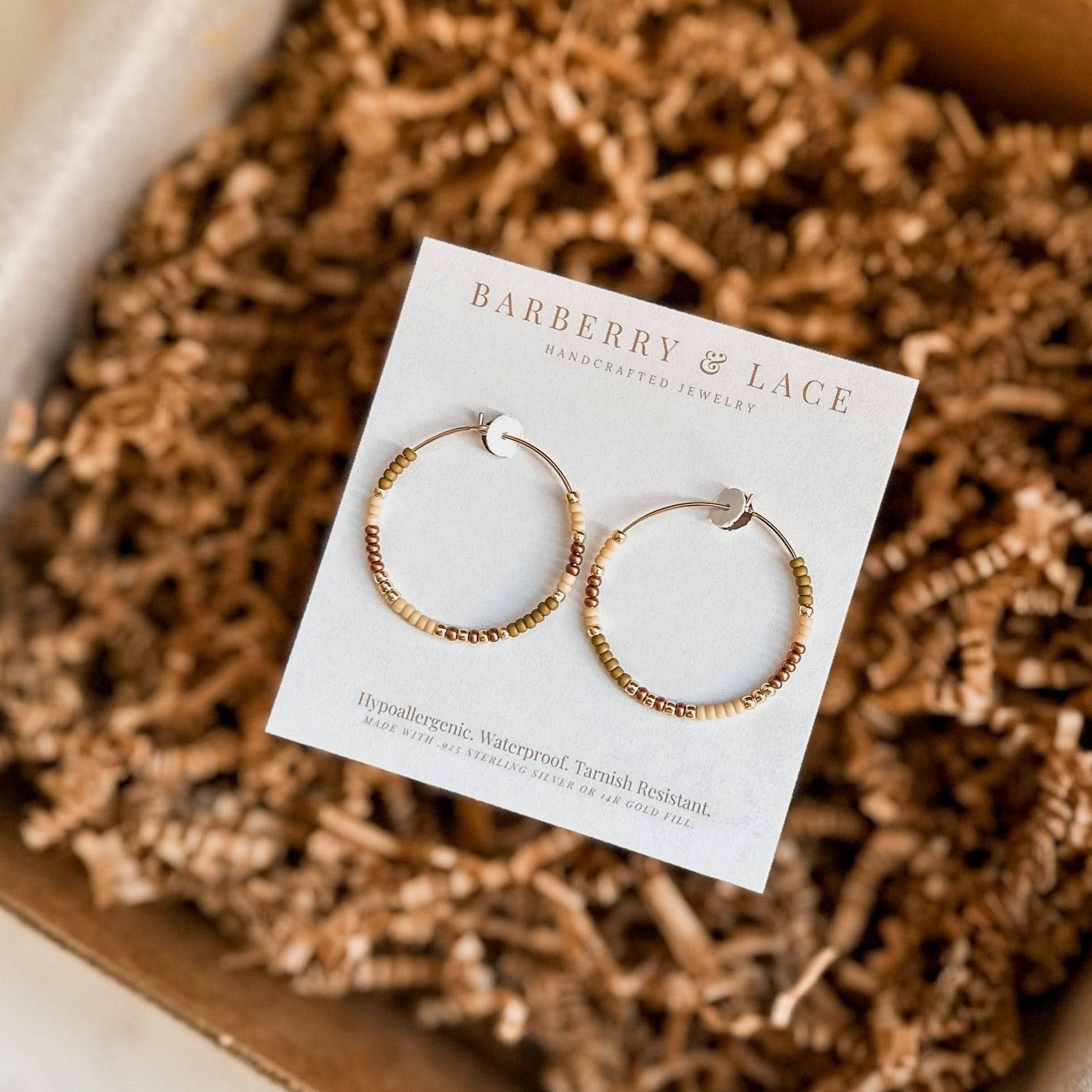 Fall Edition - Beaded Hoop Earrings by Barberry & Lace Jewelry displayed on branded card with gold and copper beads. Hypoallergenic and waterproof.