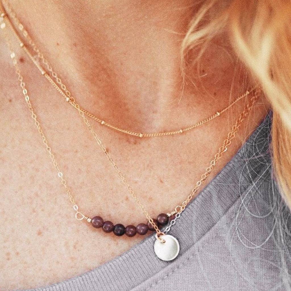 Layered Satellite Chain Necklace styled with gemstone and disc pendants, showcasing minimalist gold layering from Barberry & Lace Jewelry.