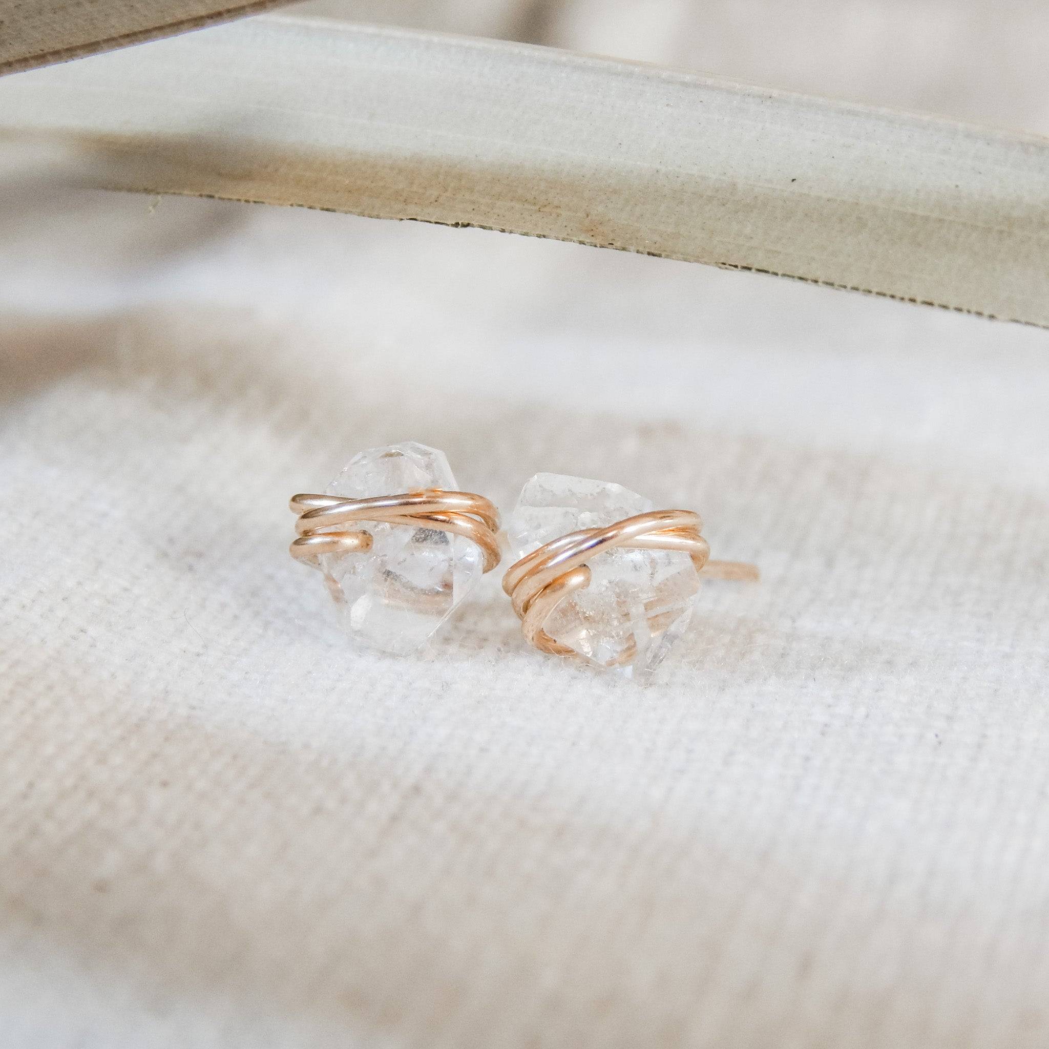 Close-up of Herkimer Diamond Stud Earrings with raw quartz stones and 14k gold fill wire, part of Barberry & Lace Jewelry's hypoallergenic collection.