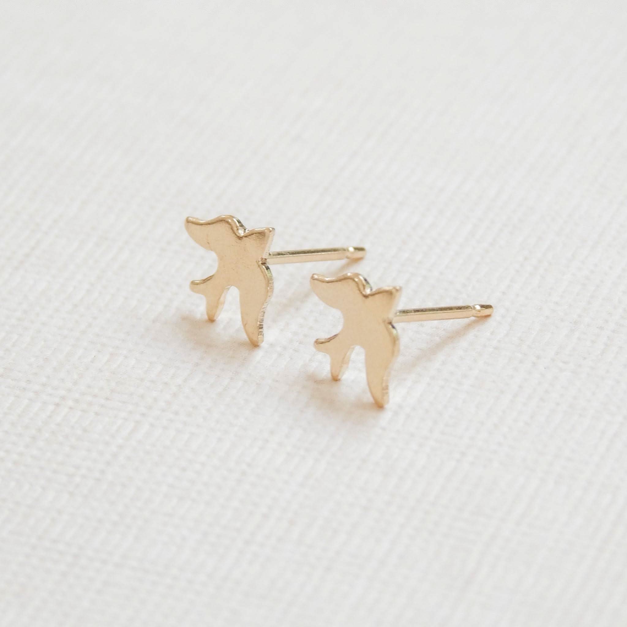 Close-up of Petite Bird Stud Earrings in 14k Gold Fill, highlighting their hypoallergenic and waterproof design for daily wear.