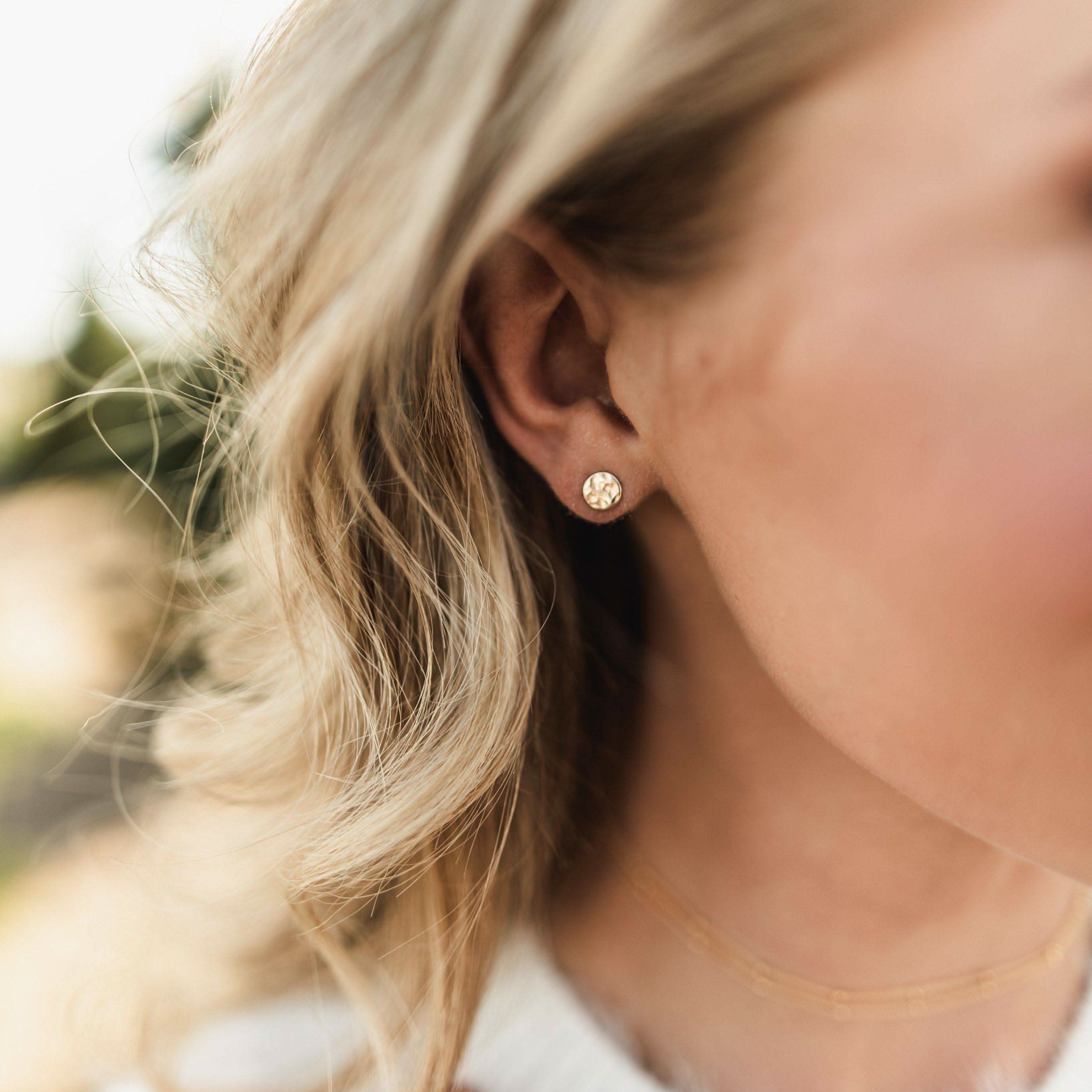 Woman wearing Hypoallergenic Circle Stud Earrings by Barberry & Lace. Lightweight gold studs perfect for sensitive ears.