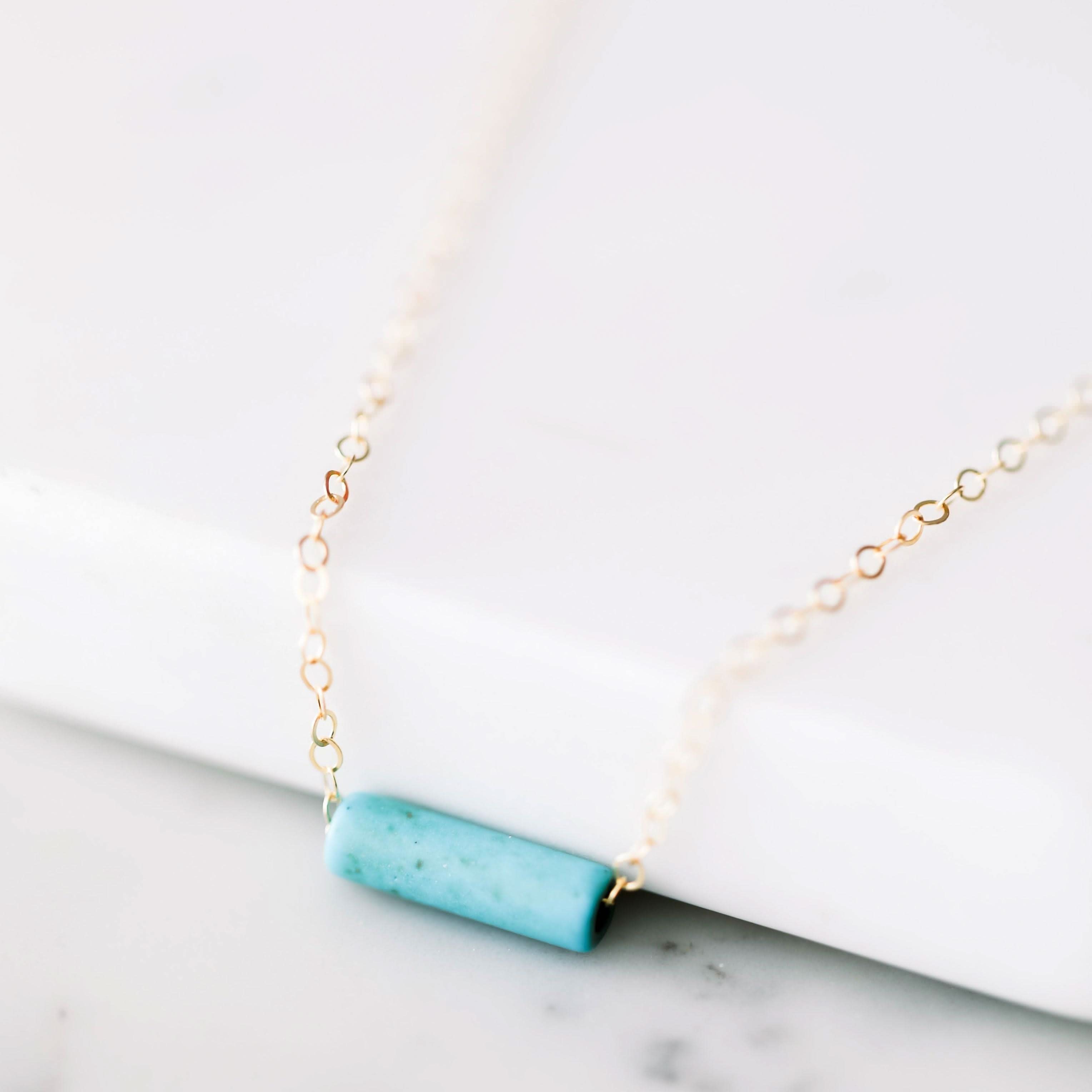 Dainty Turquoise Tube Necklace by Barberry & Lace Jewelry featuring a minimalist turquoise bar pendant on a delicate gold chain, perfect for layering.