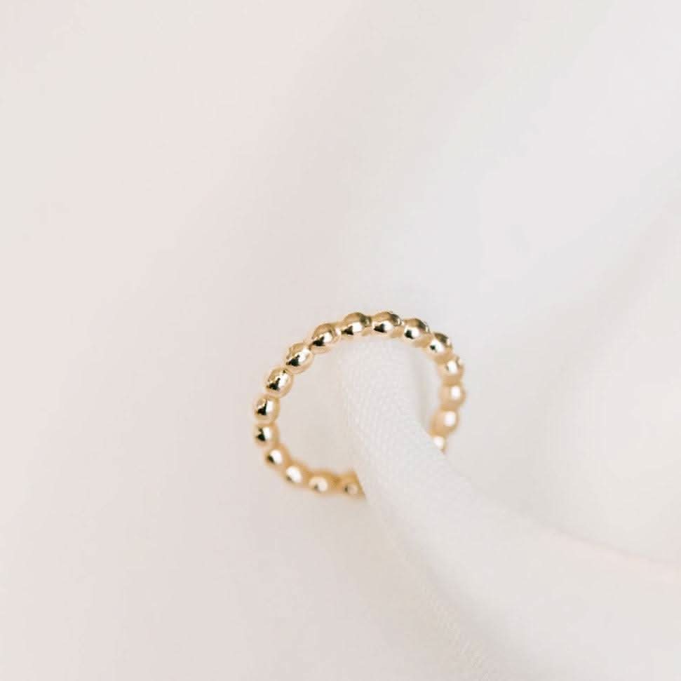Beaded texture no-pierce ear cuff earring in 14k gold fill, offering a chic and hypoallergenic jewelry option.