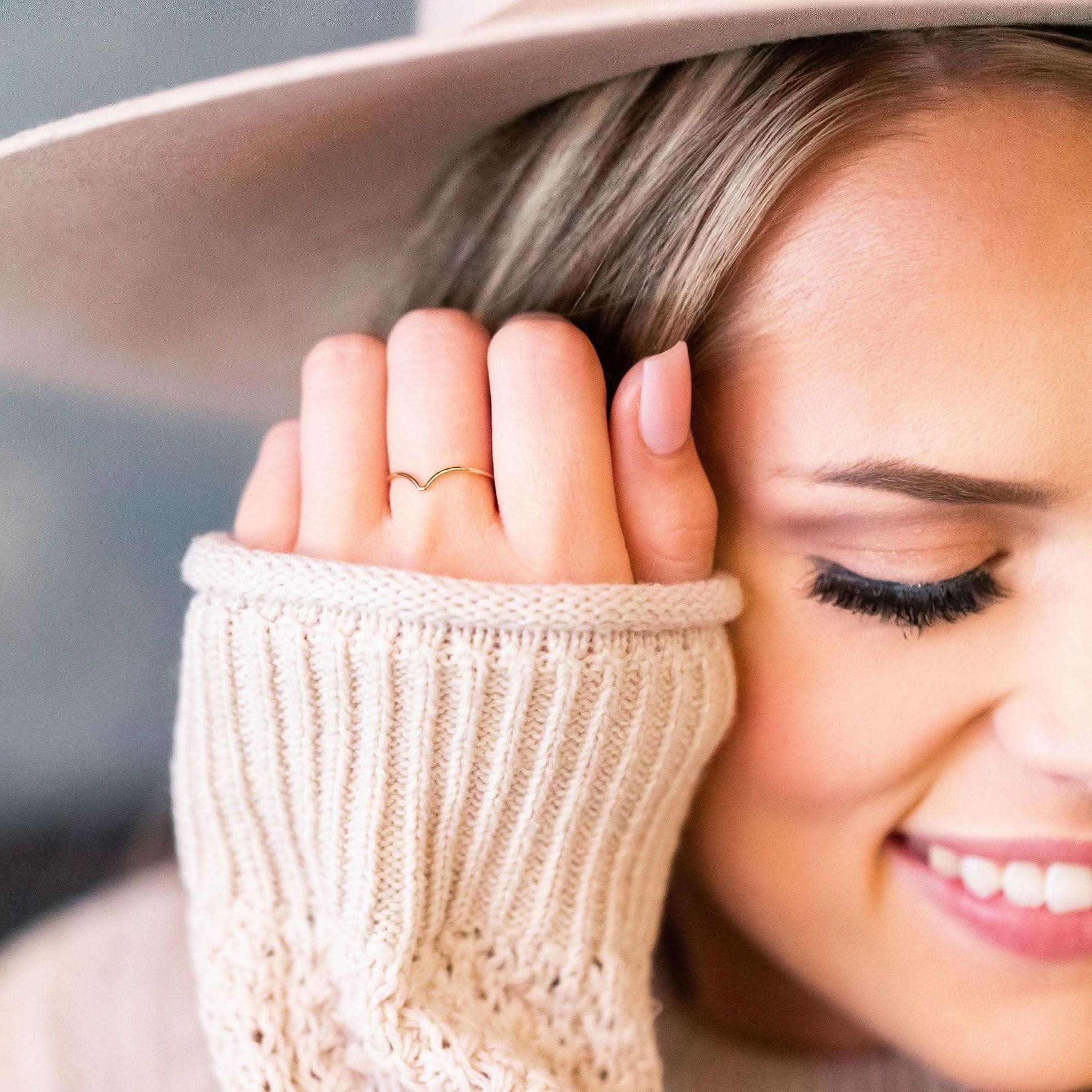 Woman wearing Chevron Stacking Ring by Barberry & Lace Jewelry, showcasing its delicate gold design perfect for everyday stacking.