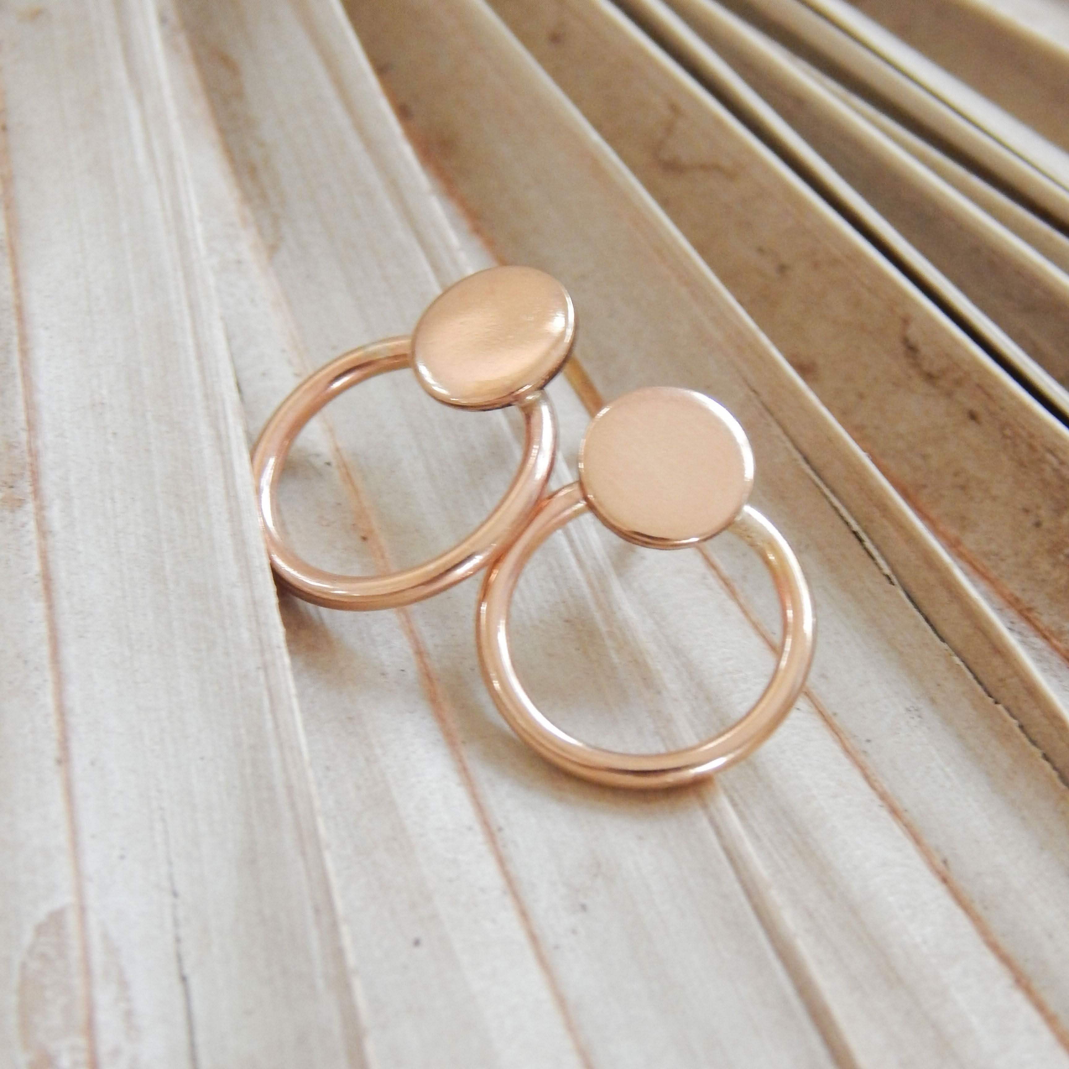 Soleil Stud Earrings by Barberry & Lace Jewelry featuring minimalist circular design in polished gold, displayed on neutral textured background.