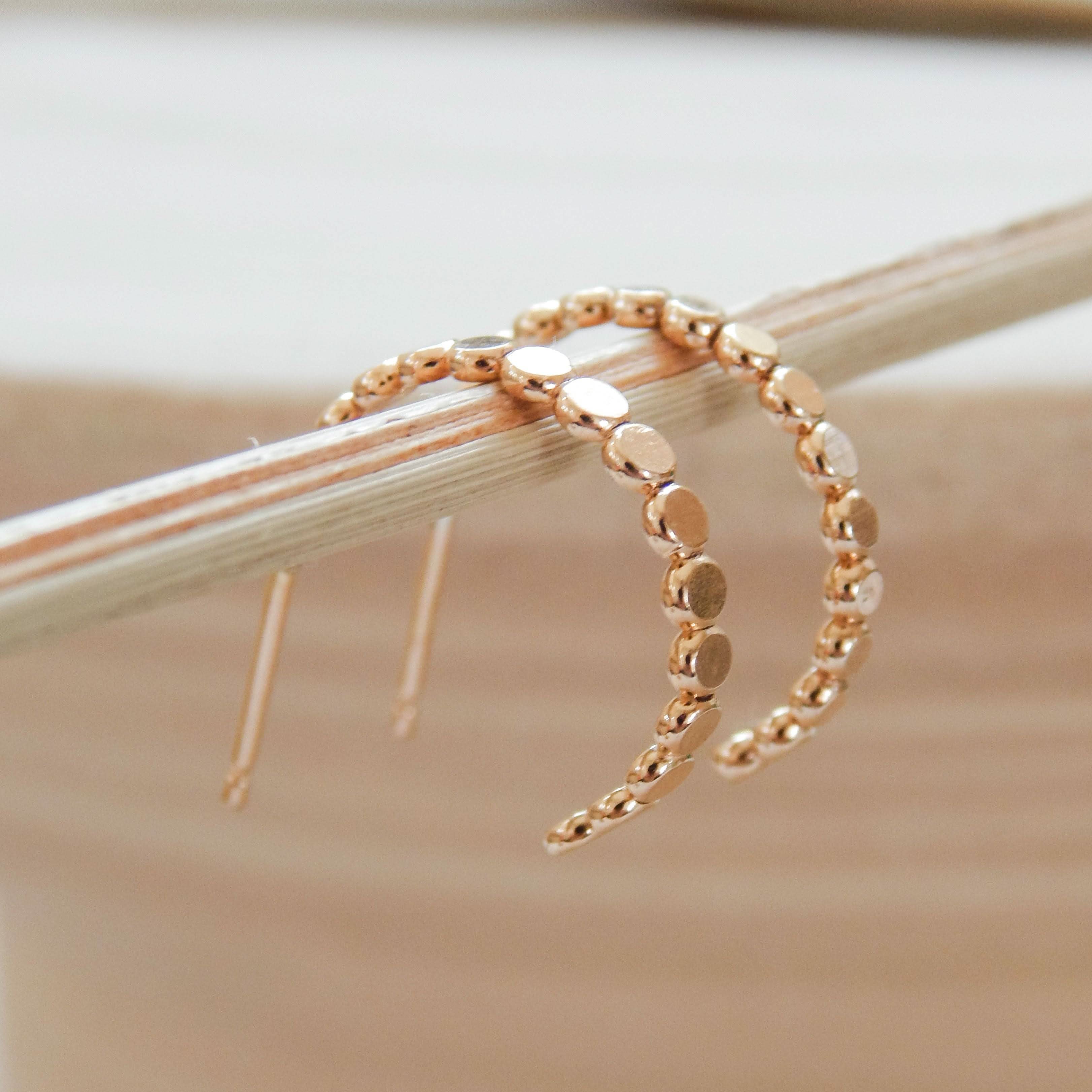 Close-up of Barberry & Lace Pebble Hoop Stud Earrings with polished pebble detailing, ideal for modern jewelry collections.