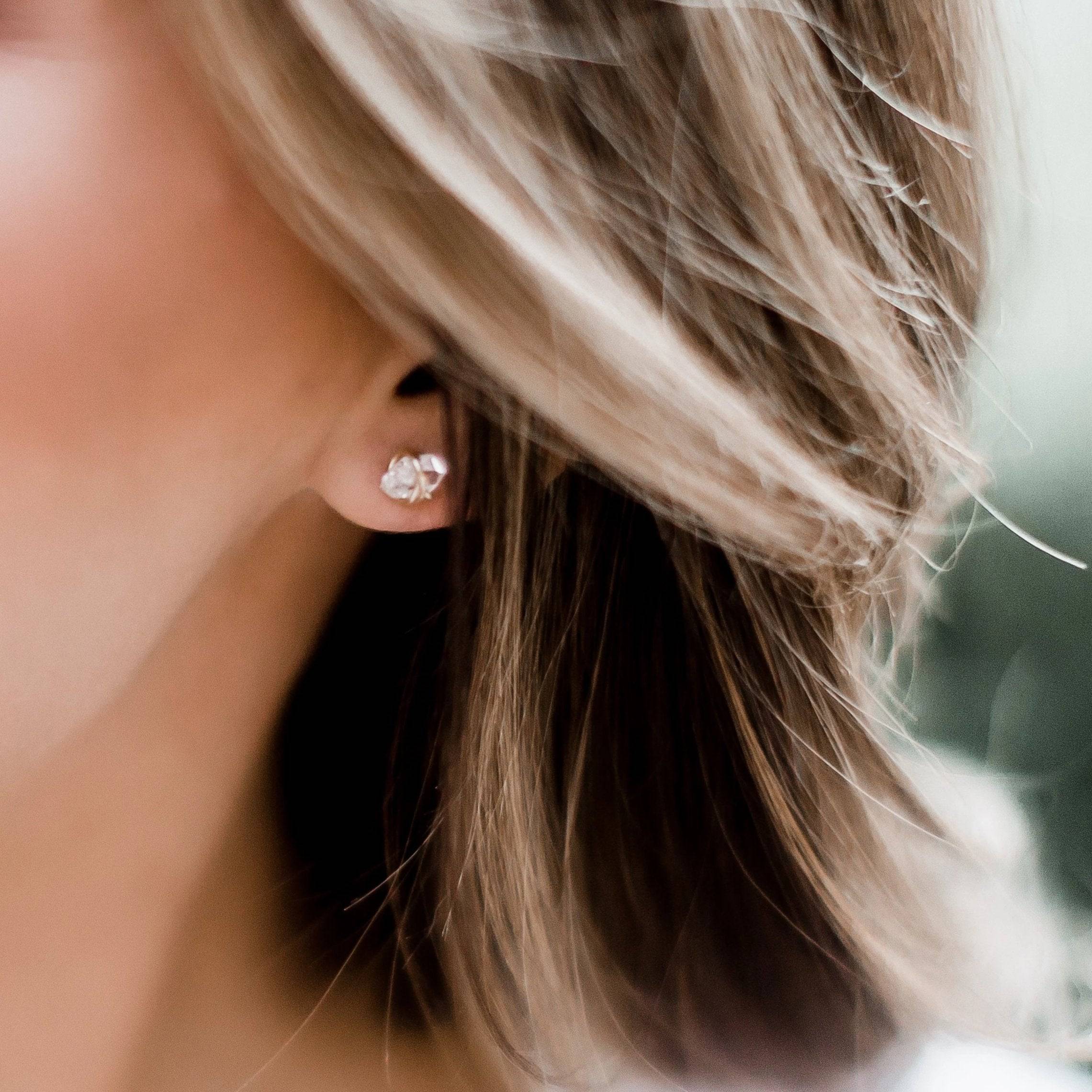 Side profile of a woman wearing Barberry & Lace Herkimer Diamond Stud Earrings, highlighting the natural sparkle and elegant gold setting.
