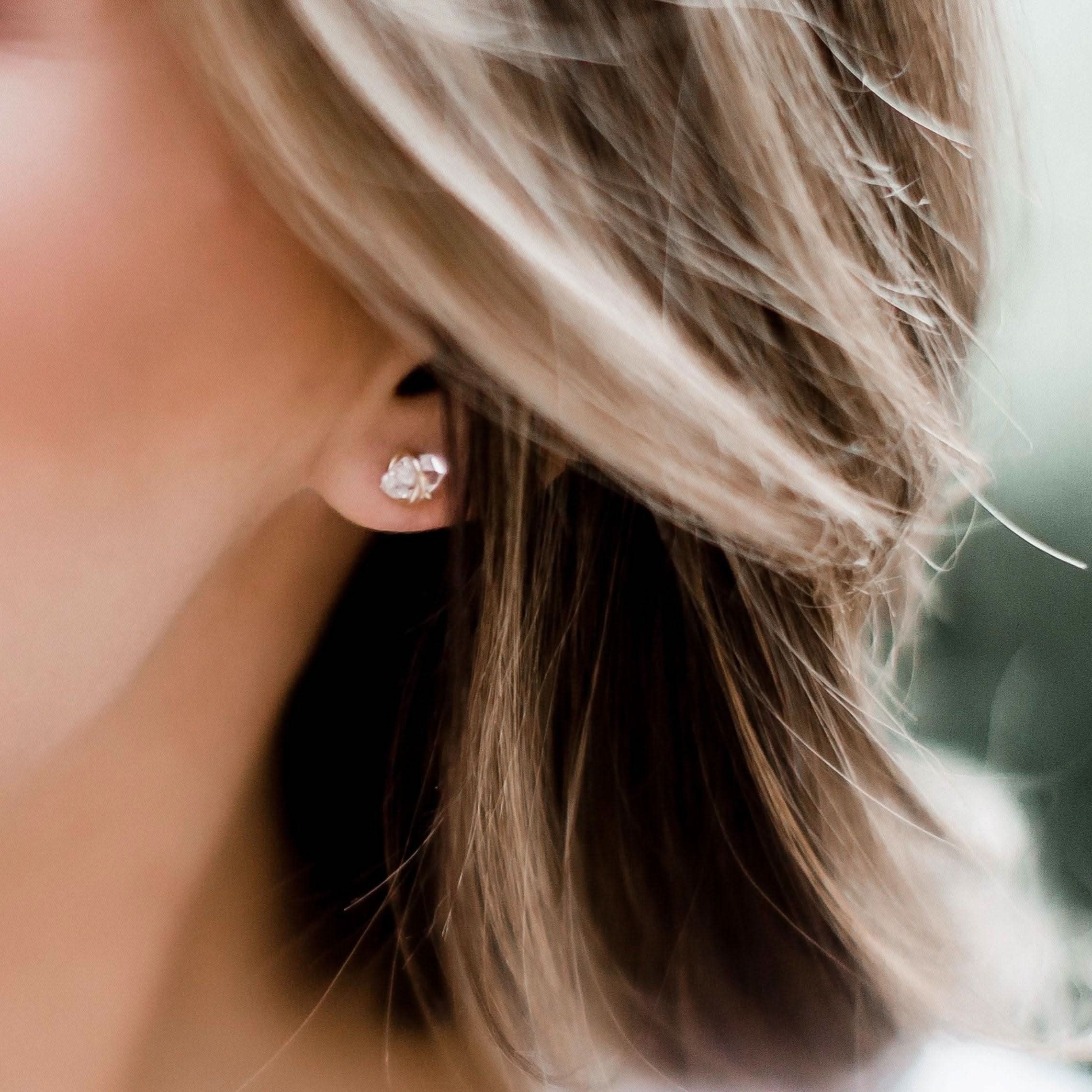 Side profile of a woman wearing Barberry & Lace Herkimer Diamond Stud Earrings, highlighting the natural sparkle and elegant gold setting.