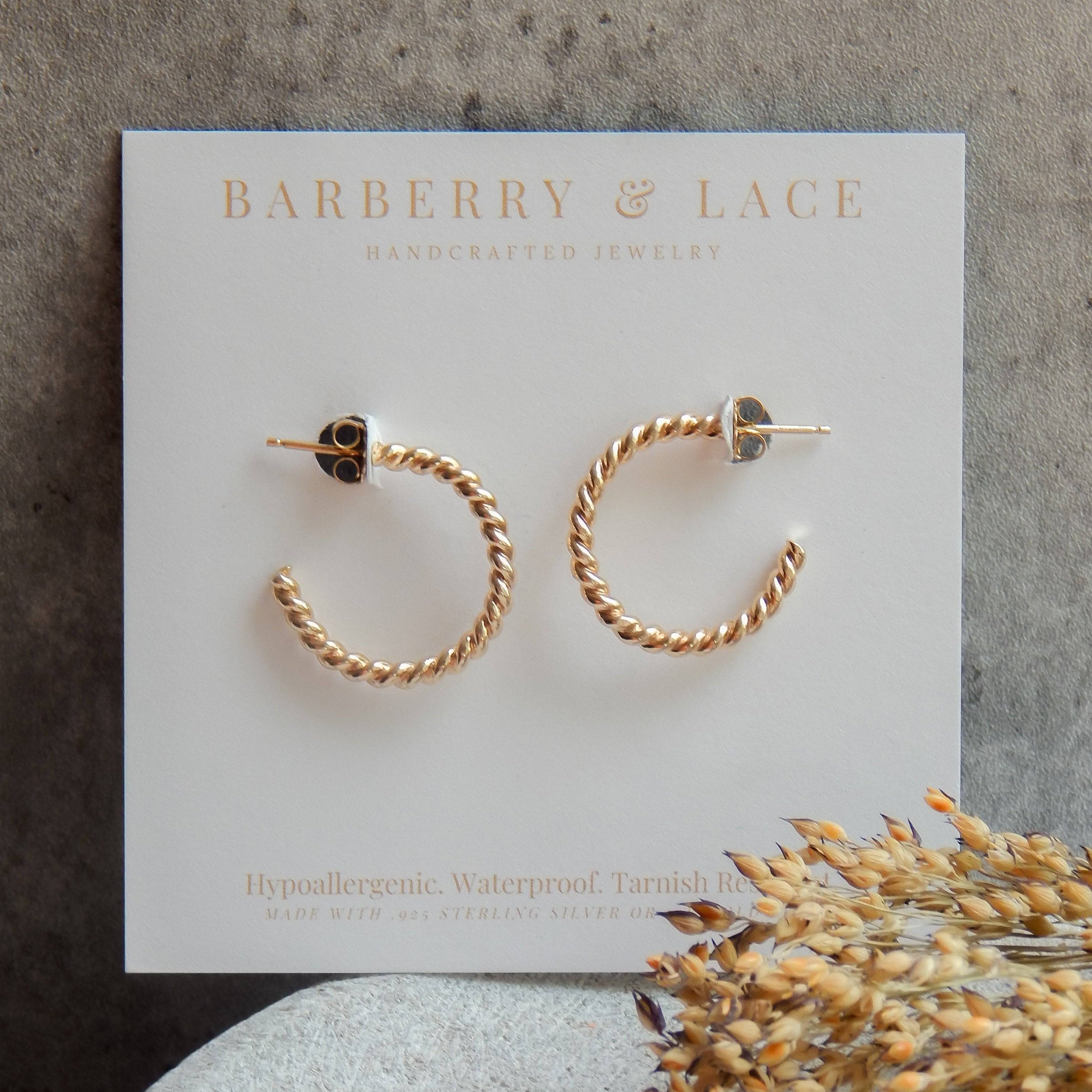 Twist Hoop Earrings by Barberry & Lace Jewelry displayed on branded card. Hypoallergenic, waterproof, and tarnish-resistant design in gold tone.