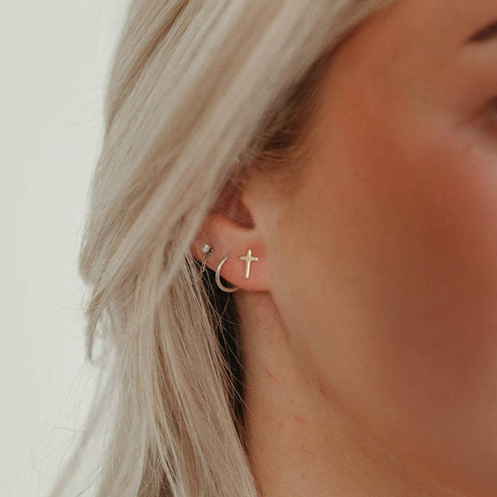 Hypoallergenic Cross Stud Earrings by Barberry & Lace Jewelry, featuring a minimalist sterling silver cross design ideal for sensitive ears.