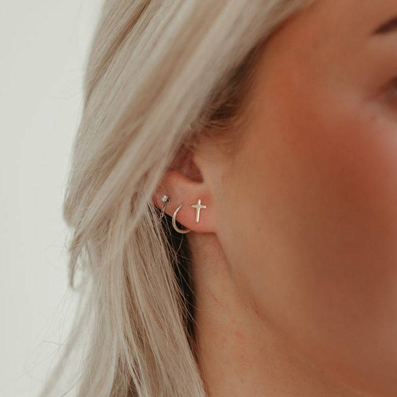 Hypoallergenic Cross Stud Earrings by Barberry & Lace Jewelry, featuring a minimalist sterling silver cross design ideal for sensitive ears.