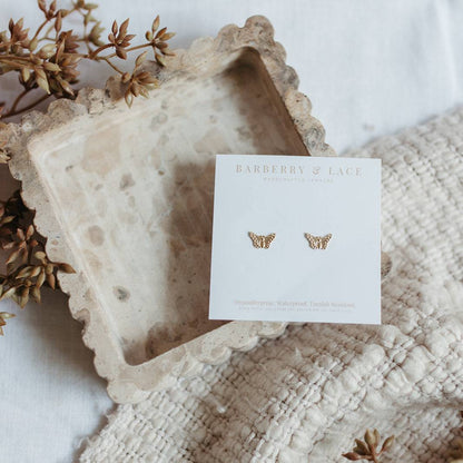 Butterfly Stud Earrings on Barberry & Lace Jewelry card, highlighting hypoallergenic and waterproof features for sensitive ears.