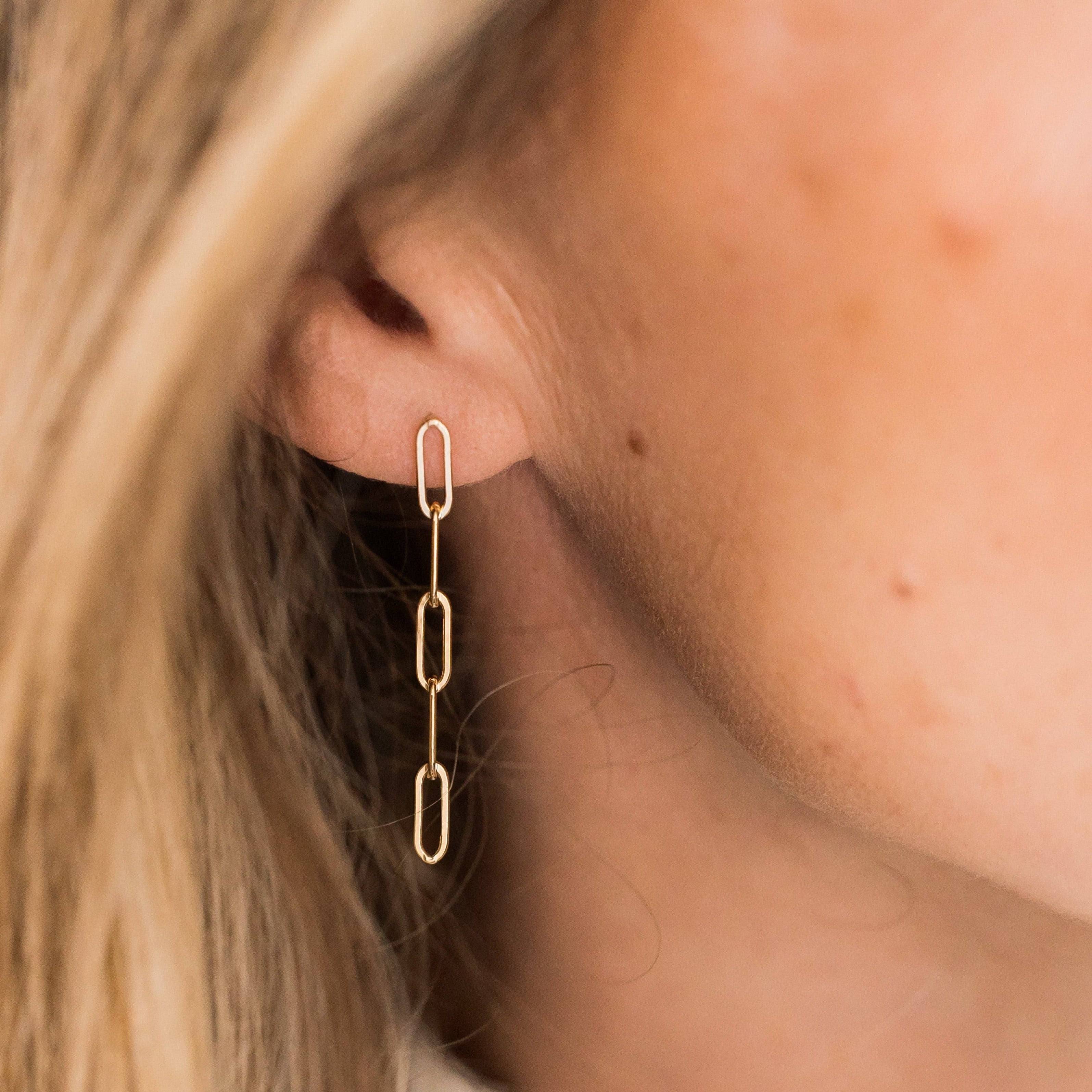 Close-up of woman wearing Barberry & Lace Paperclip Stud Earrings in 14k Gold Fill, showcasing minimalist chain-link design for everyday style.