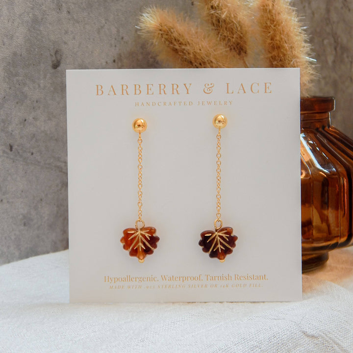 Falling Leaf Earrings by Barberry & Lace feature gold-filled chains with amber leaf charms. Hypoallergenic and waterproof for everyday autumn style.