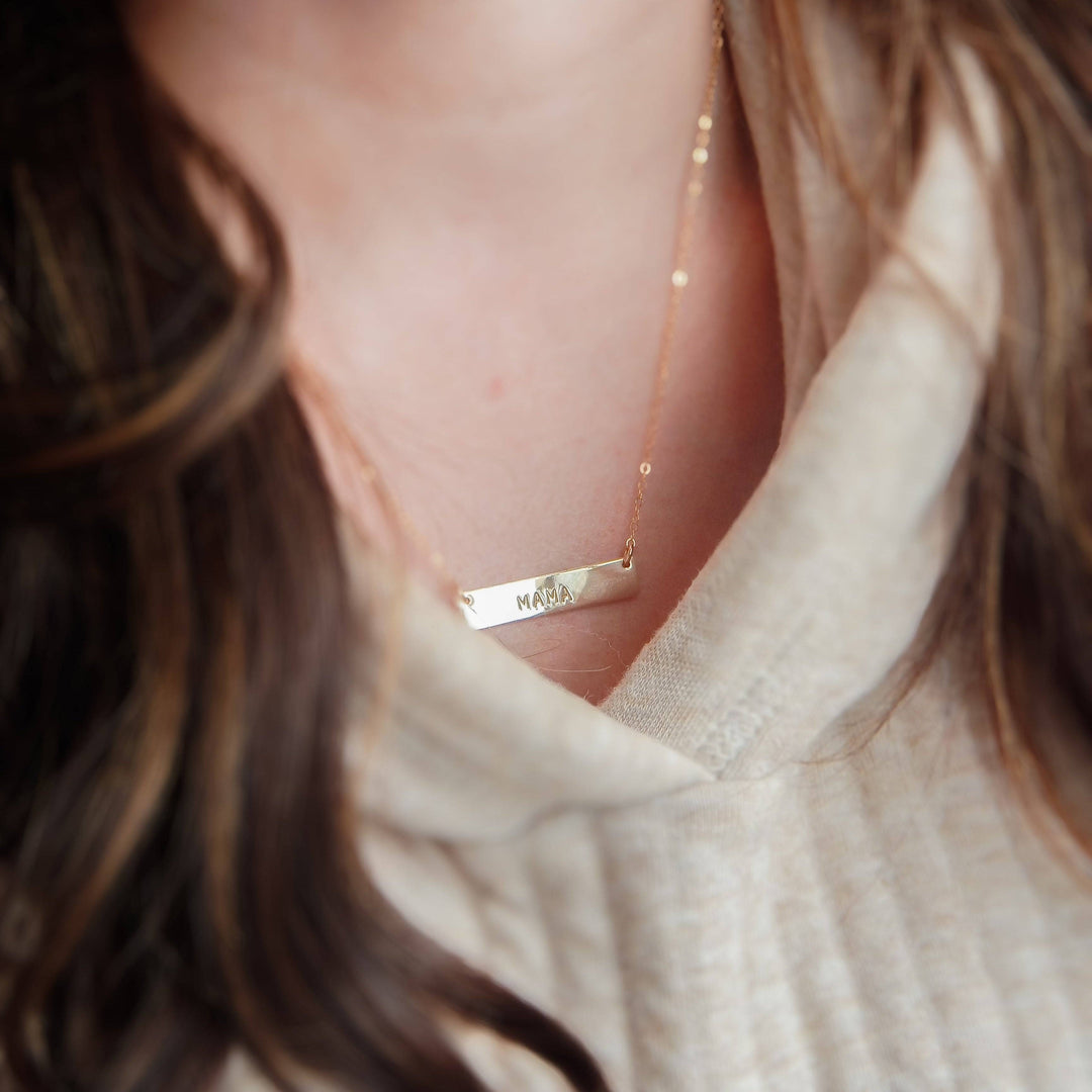 Hand Stamped MAMA Bar Necklace by Barberry & Lace Jewelry, featuring a 14k Gold Fill bar pendant on a delicate chain, perfect for Mother's Day gifts.