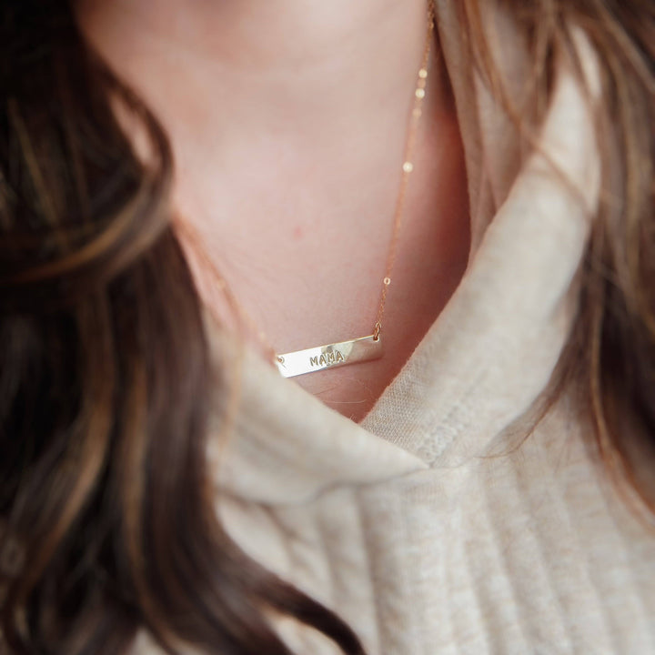 Hand Stamped MAMA Bar Necklace by Barberry & Lace Jewelry, featuring a 14k Gold Fill bar pendant on a delicate chain, perfect for Mother's Day gifts.