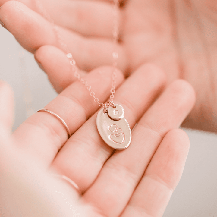 Hand Stamped Mother & Child Necklace by Barberry & Lace Jewelry featuring 14k gold customizable pendants with initials and heart design.