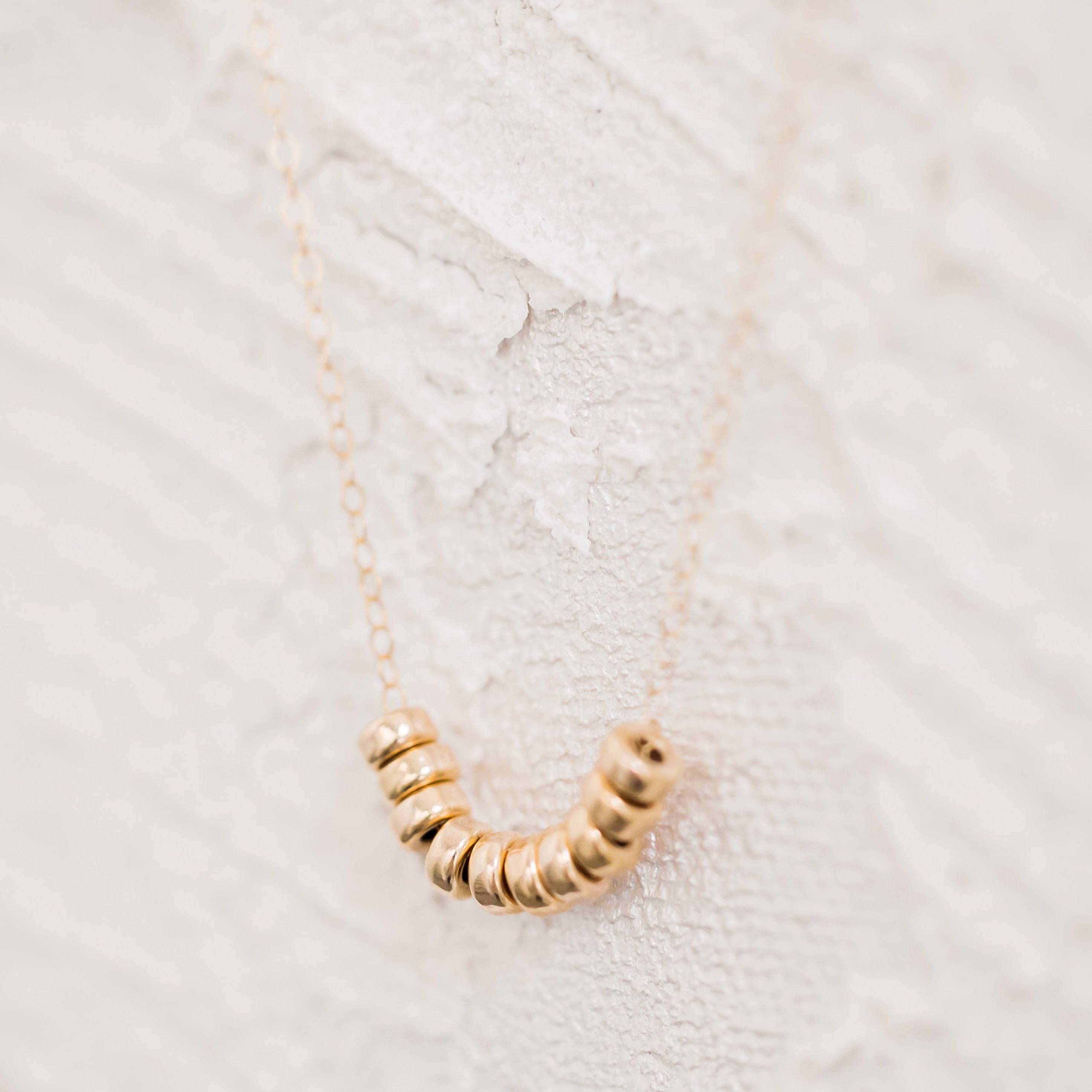 Roundel Bead Necklace by Barberry & Lace featuring 14k gold filled beads on a delicate chain, perfect for elegant everyday wear.