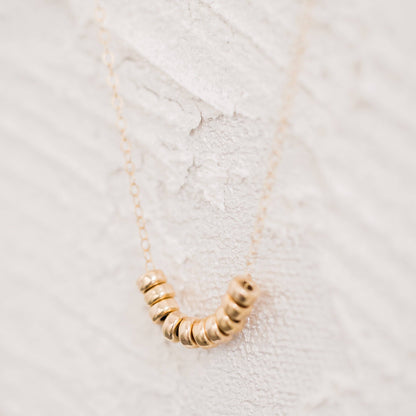 Roundel Bead Necklace by Barberry & Lace featuring 14k gold filled beads on a delicate chain, perfect for elegant everyday wear.