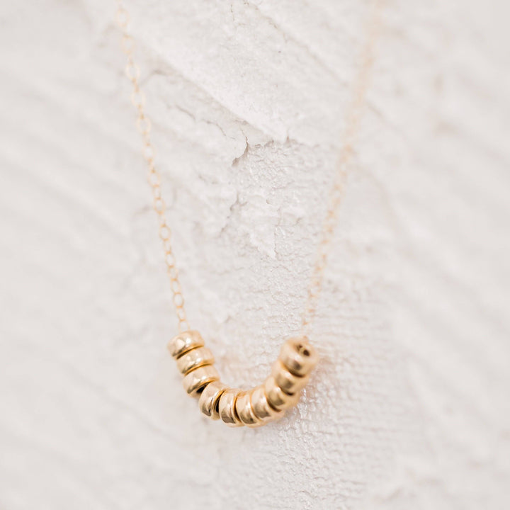 Roundel Bead Necklace by Barberry & Lace featuring 14k gold filled beads on a delicate chain, perfect for elegant everyday wear.
