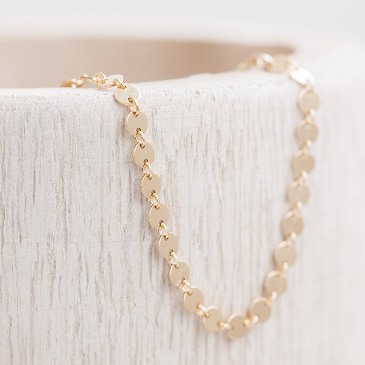 Disc Chain Anklet by Barberry & Lace Jewelry in 14k Gold Fill, featuring shimmering flat discs on a delicate chain. Hypoallergenic and waterproof.