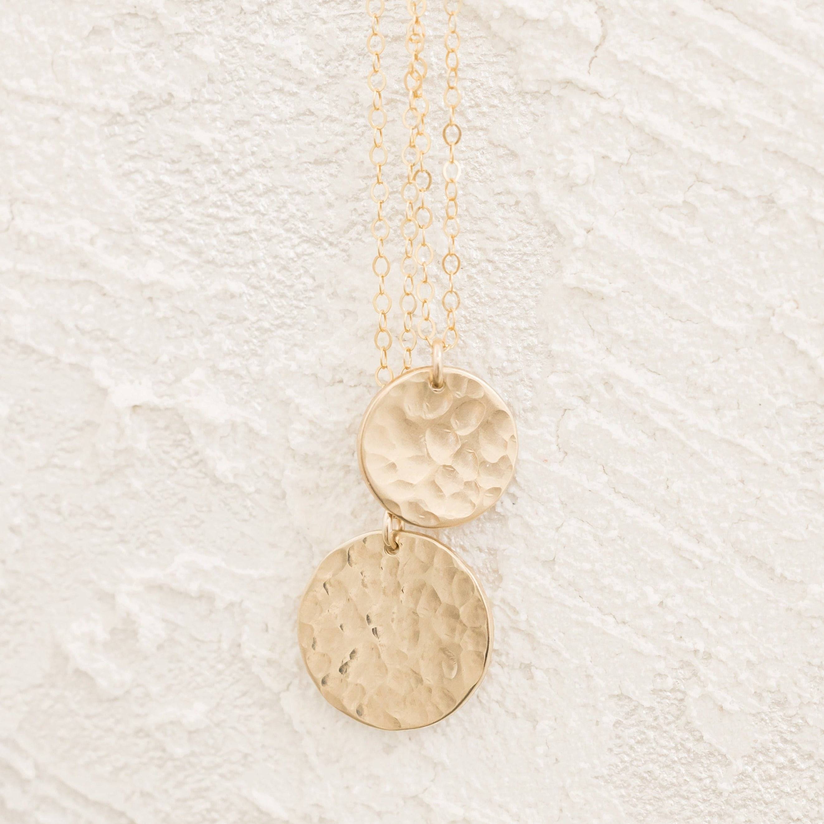 Close-up of two Layering Hammered Disc Necklaces in 14k Gold Fill, highlighting the textured artisanal finish and lightweight design.