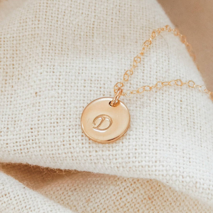 3/8" Personalized Disc Necklace by Barberry & Lace Jewelry featuring a gold disc with engraved initial D, ideal for daily wear and gifting.