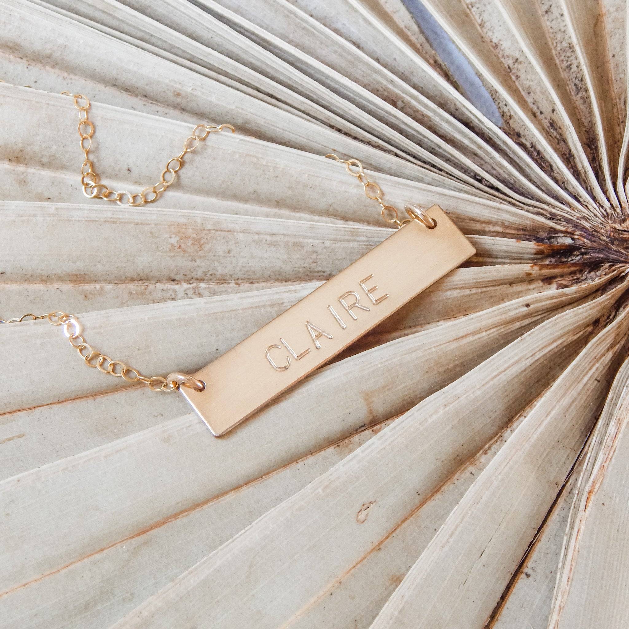 Personalized Bar Necklace by Barberry & Lace Jewelry featuring the name 'Claire' engraved on a 14k Gold Fill bar, ideal for sensitive skin.