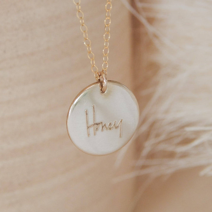 Handwritten Disc Necklace by Barberry & Lace Jewelry featuring 'Honey' engraving on a gold fill disc, perfect for personalized gifts.