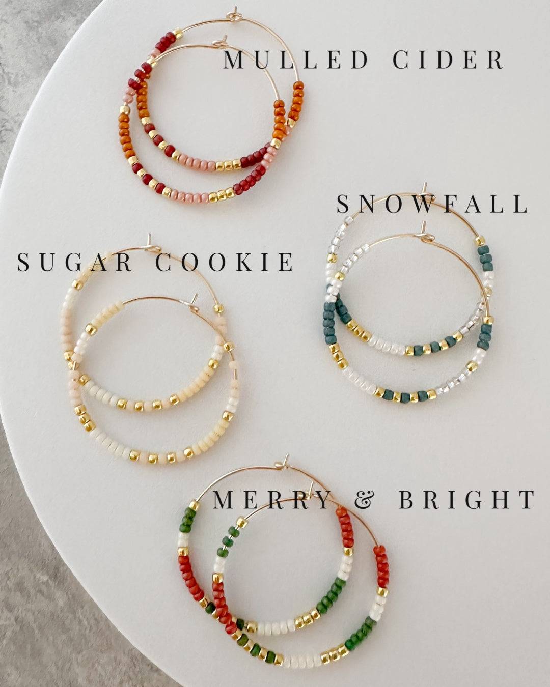 Holiday Edition - Beaded Hoop Earrings in four festive styles: Mulled Cider, Sugar Cookie, Snowfall, and Merry & Bright. Perfect holiday accessories.