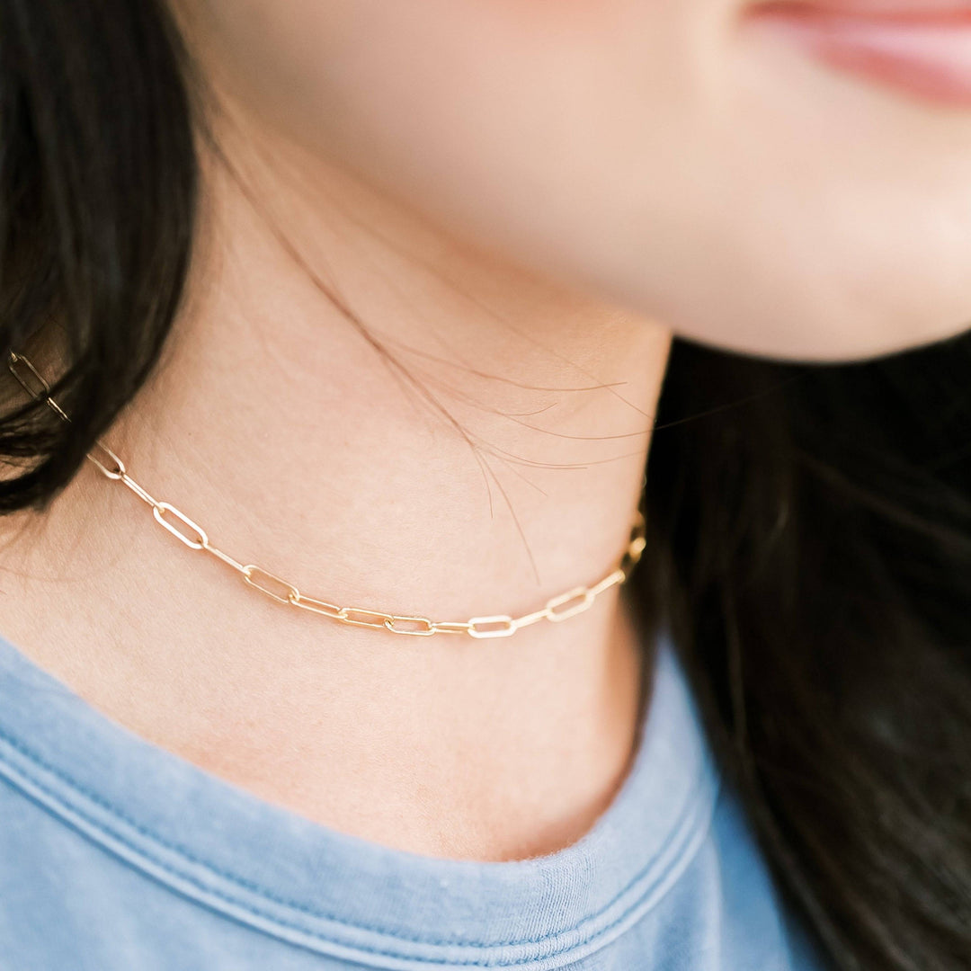 Model wearing Barberry & Lace Layering Paperclip Chain Necklace in gold, styled as a choker for a minimalist everyday jewelry look.