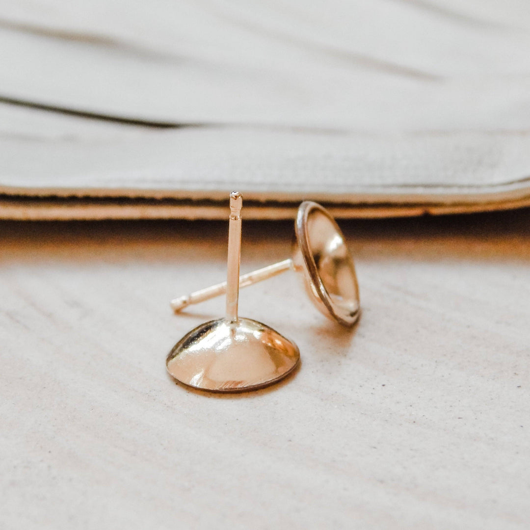 Close-up of Concave Disc Stud Earrings in 14k Gold Fill showing side profile and post design, ideal for everyday wear.