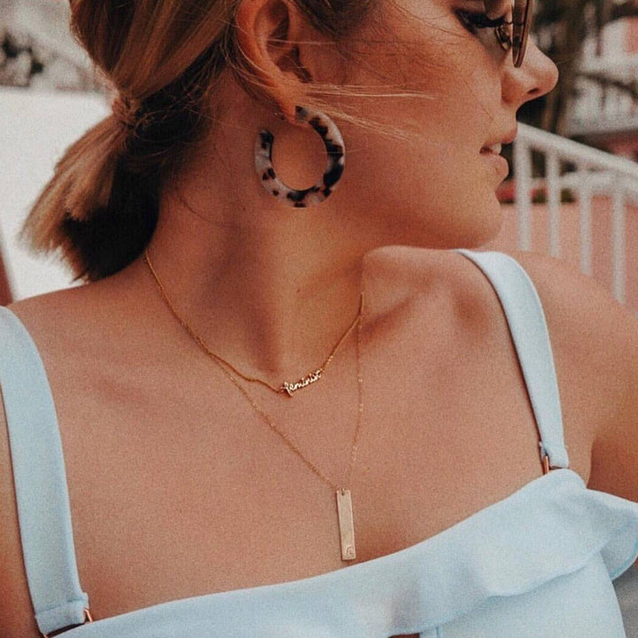 Personalized Vertical Bar Necklace by Barberry & Lace Jewelry in gold, worn layered with a name necklace, perfect for stylish, customizable gifts.