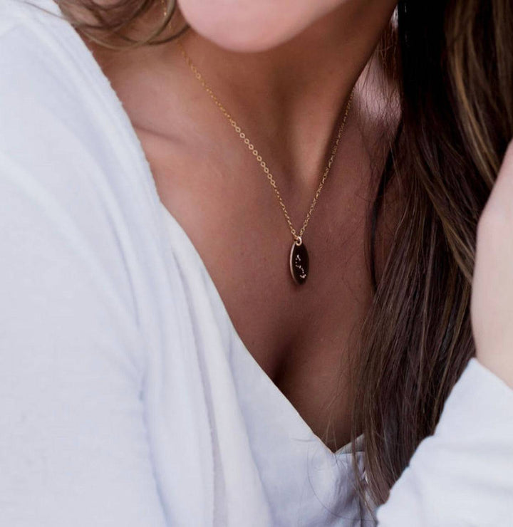 Hand Stamped Constellation Necklace by Barberry & Lace Jewelry, featuring a gold filled oval pendant on a delicate chain, perfect for everyday wear.